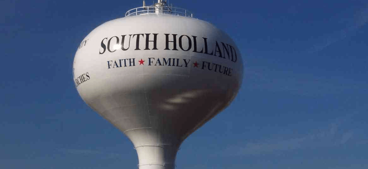 A water tower with the words 